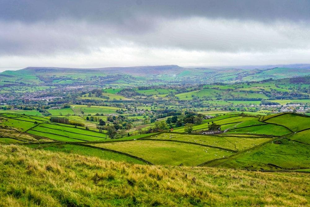 A patchwork of fields and walls below the hills