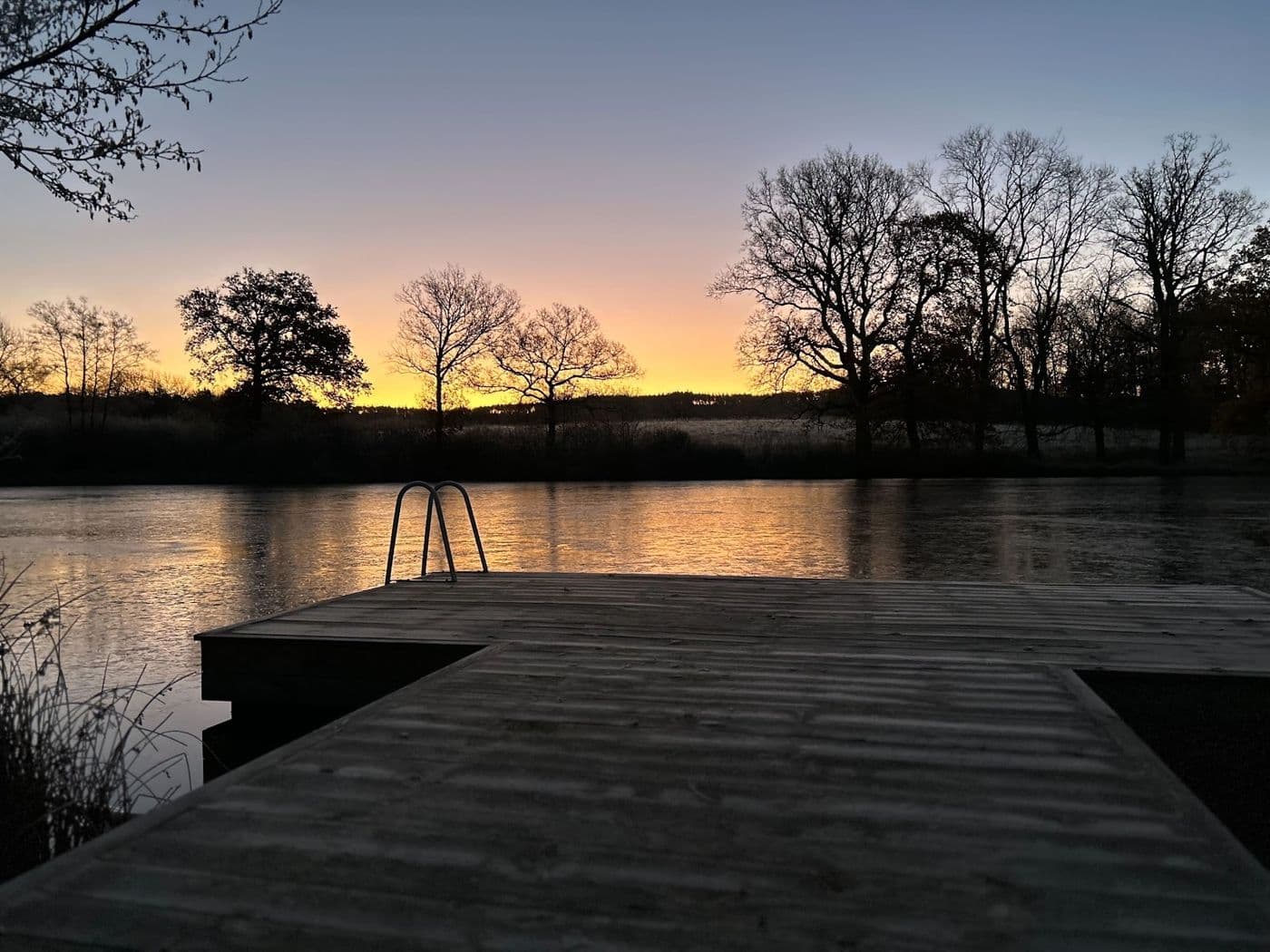 The jetty on the lake at sunset